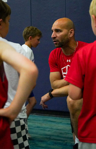 Coach talking to kids