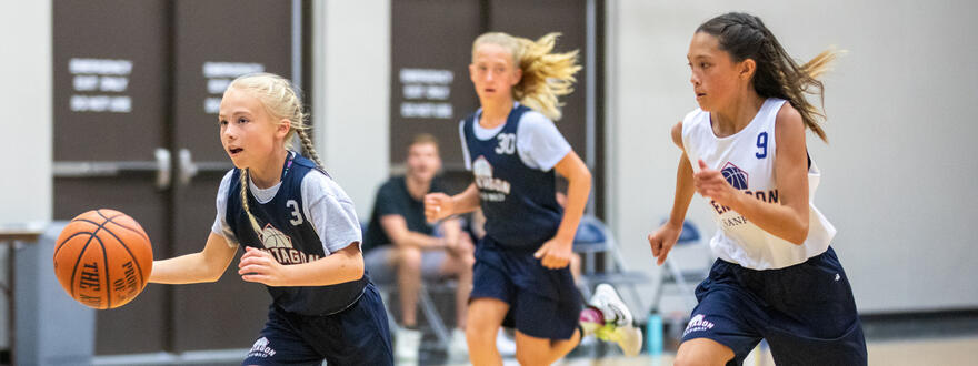 Young girls playing basketball