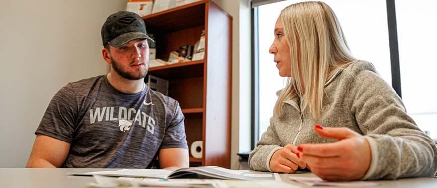 Sanford Sports Senior Sports Dietician, Natasha Hansen, discussing nutrition with former Kansas State Wildcat Ben Sinott