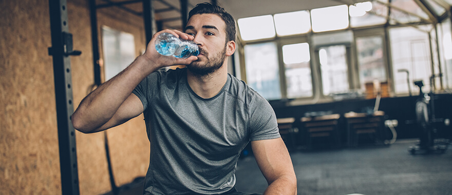 Athlete staying hydrated during a workout