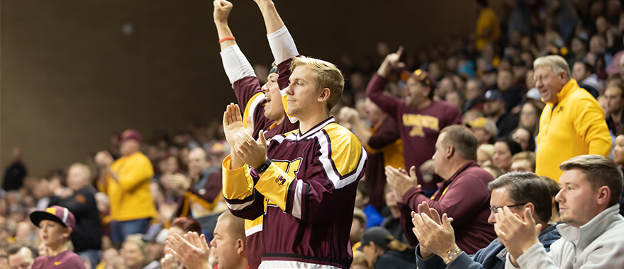 Fans cheering at University of Minnesota basketball game