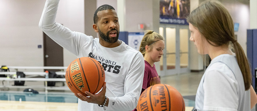 Sanford Academy basketball coach and player