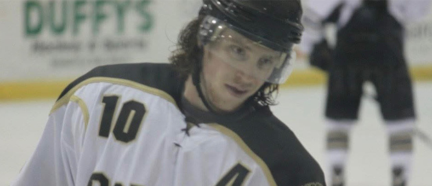 Grant Mindt playing hockey