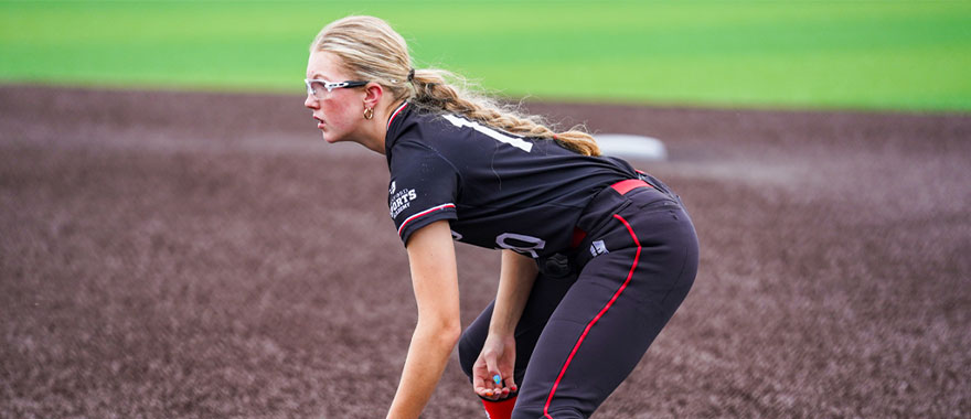 Softball player fielding ground ball