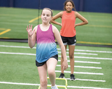 Two youth athletes working on speed & agility with Sanford Sports Performance
