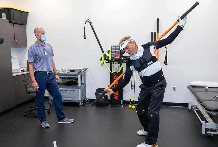 Bernhard Langer working on his flexibility during a golf specific session with the Sanford Sports Performance team. 