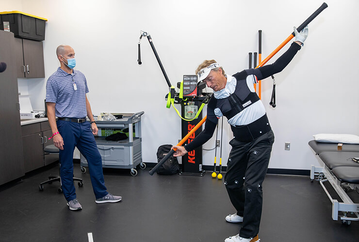 Bernhard Langer working on his flexibility during a golf specific session with the Sanford Sports Performance team.