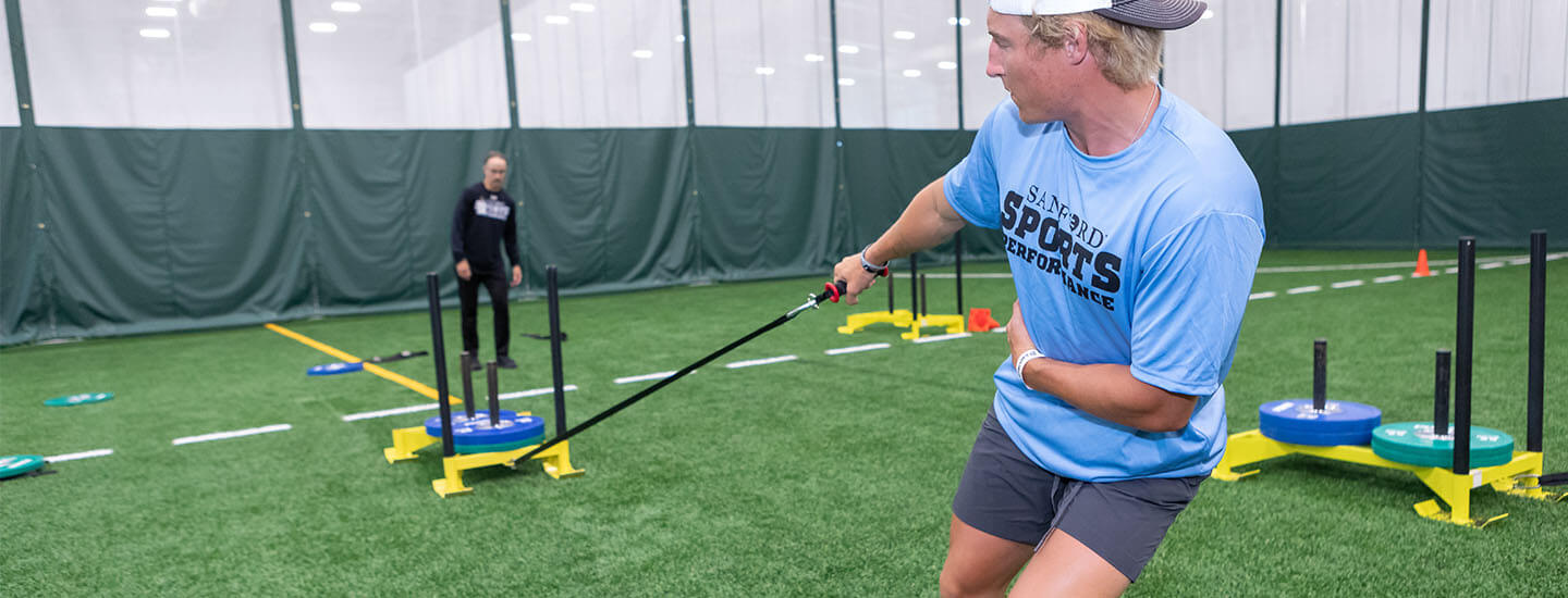 Performance athlete pulling a weighted sled