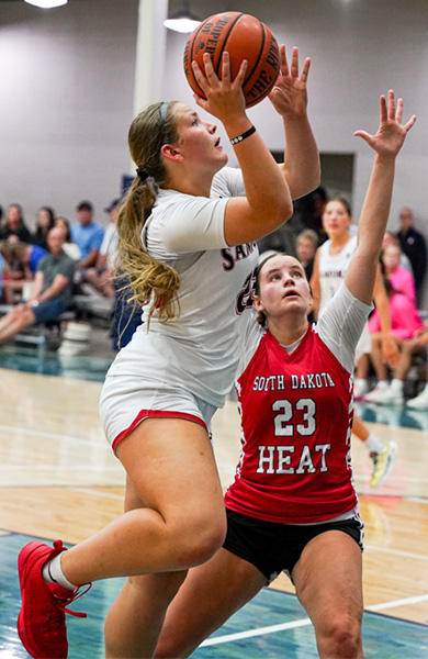 Basketball player wearing white sanford jersey