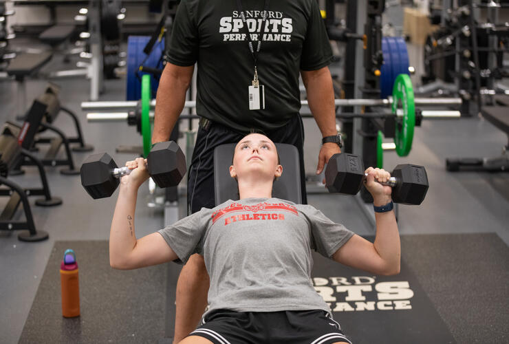strengthen your game girl dumbell bench press