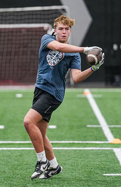Boy catching football