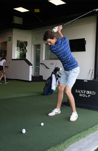 golfer practicing at Sanford Golf Academy