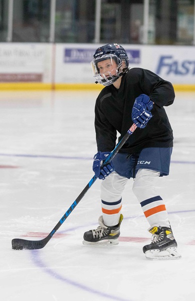 kid playing hockey