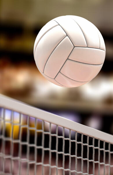 Volleyball going over net