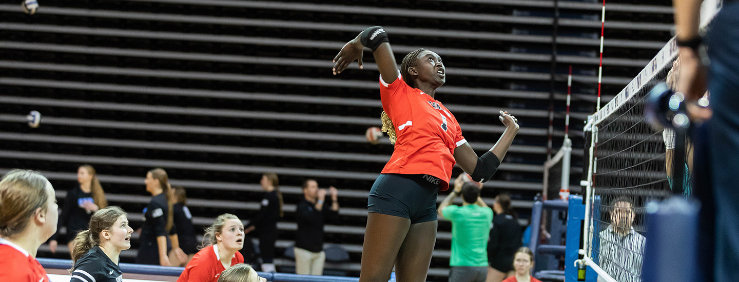 woman winding up to spike volleyball